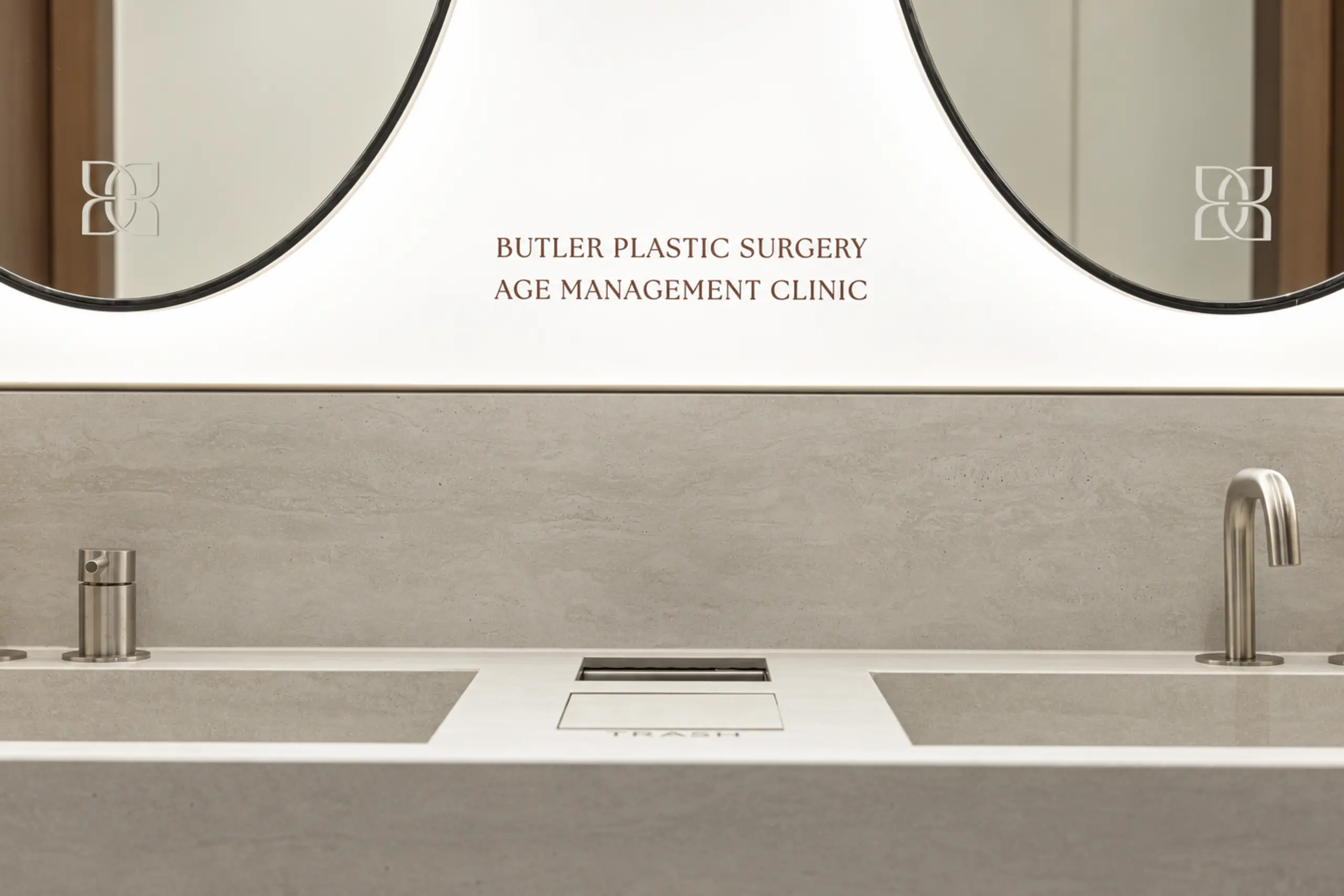 Basin with a mirror engraved Butler Plastic Surgery Clinic