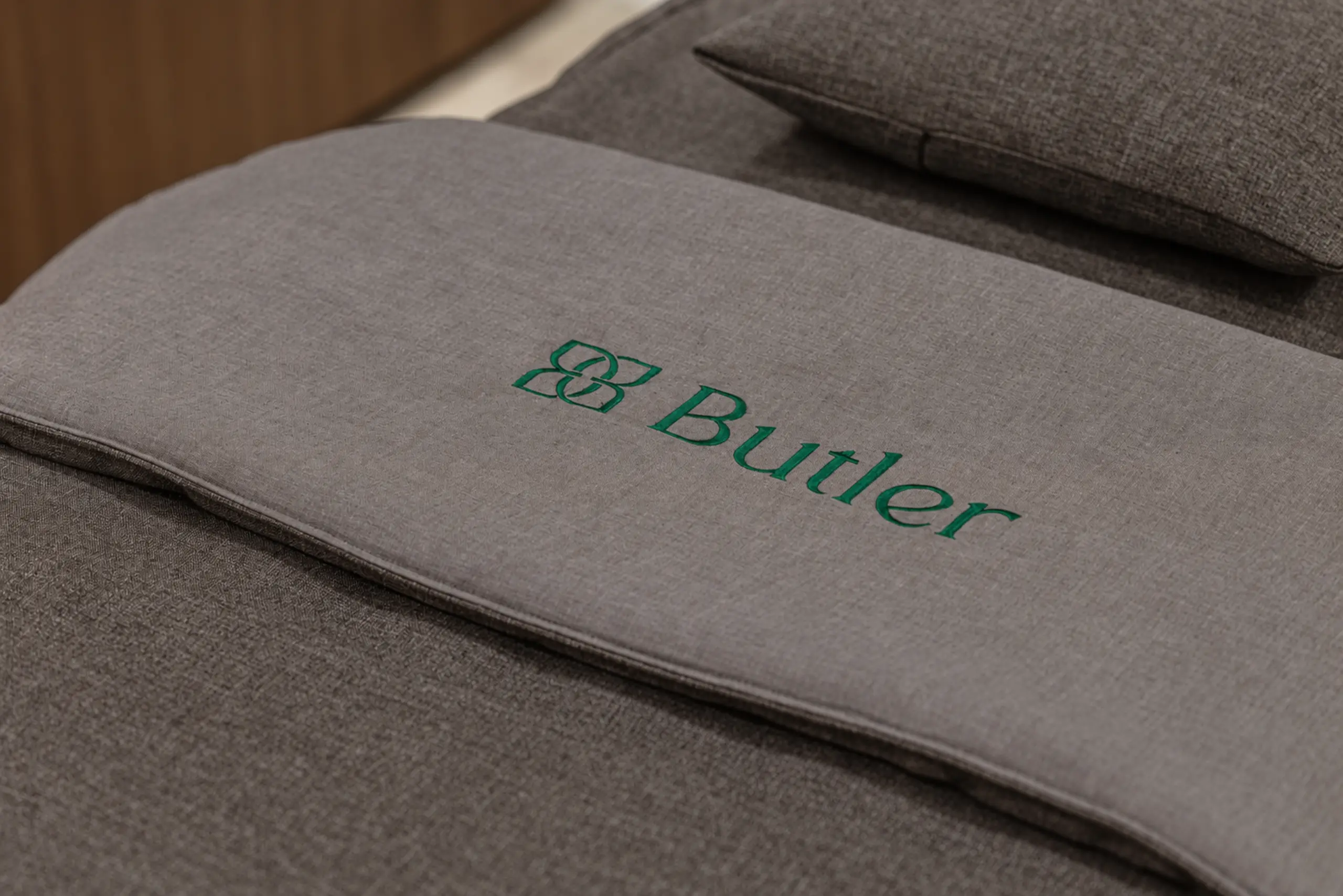 Treatment linen embroidered with the Butler Plastic Surgery Clinic logo